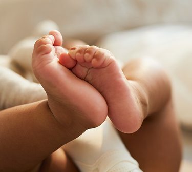 Pair of infant's feet and legs