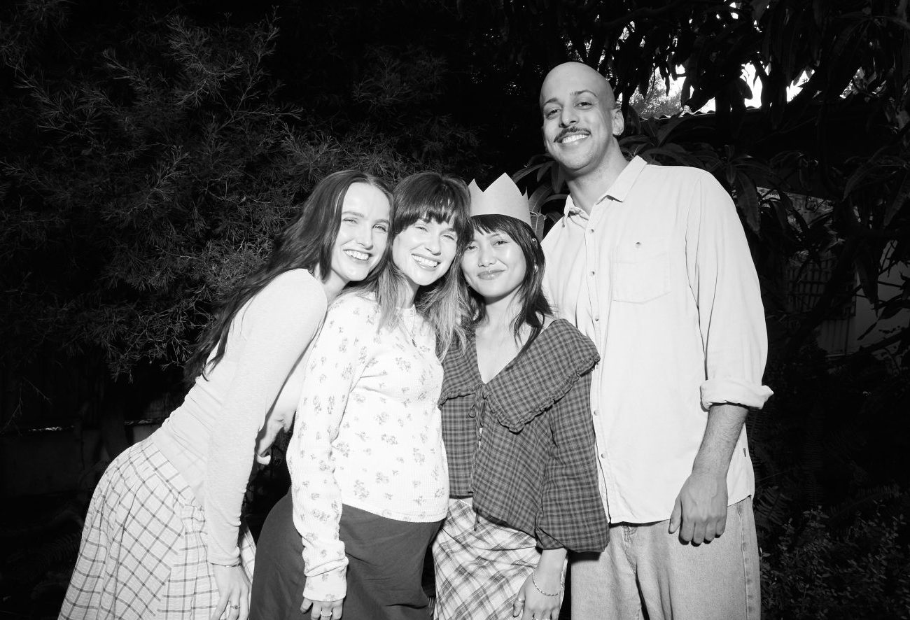 Pregnant woman posing for a photo with her friends